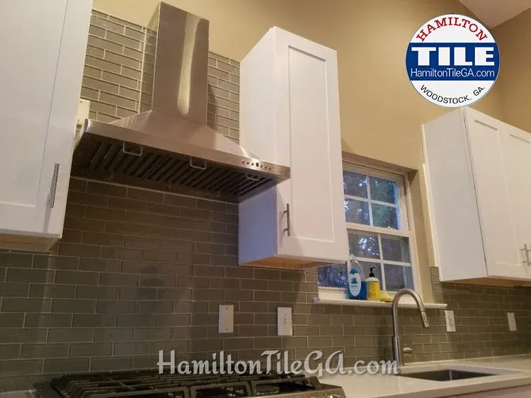 A glass back splash install in Woodstock, GA for the win.