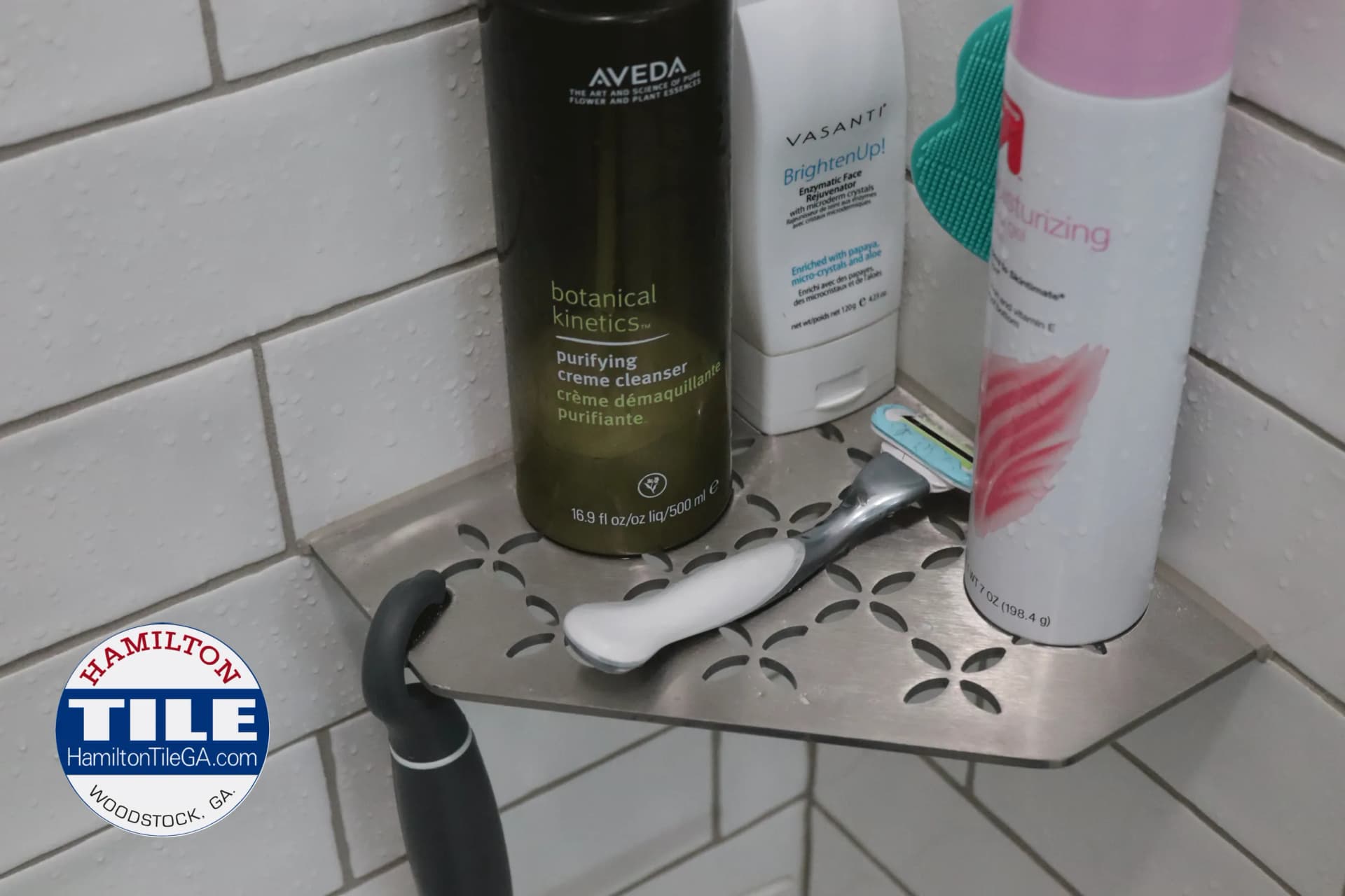 Schluter corner shelf is a clean look, the finish matching the fixtures in this shower…It’s an excellent spot to put the over flow that doesn’t fit in your soap niche. Keep that corner bench free!