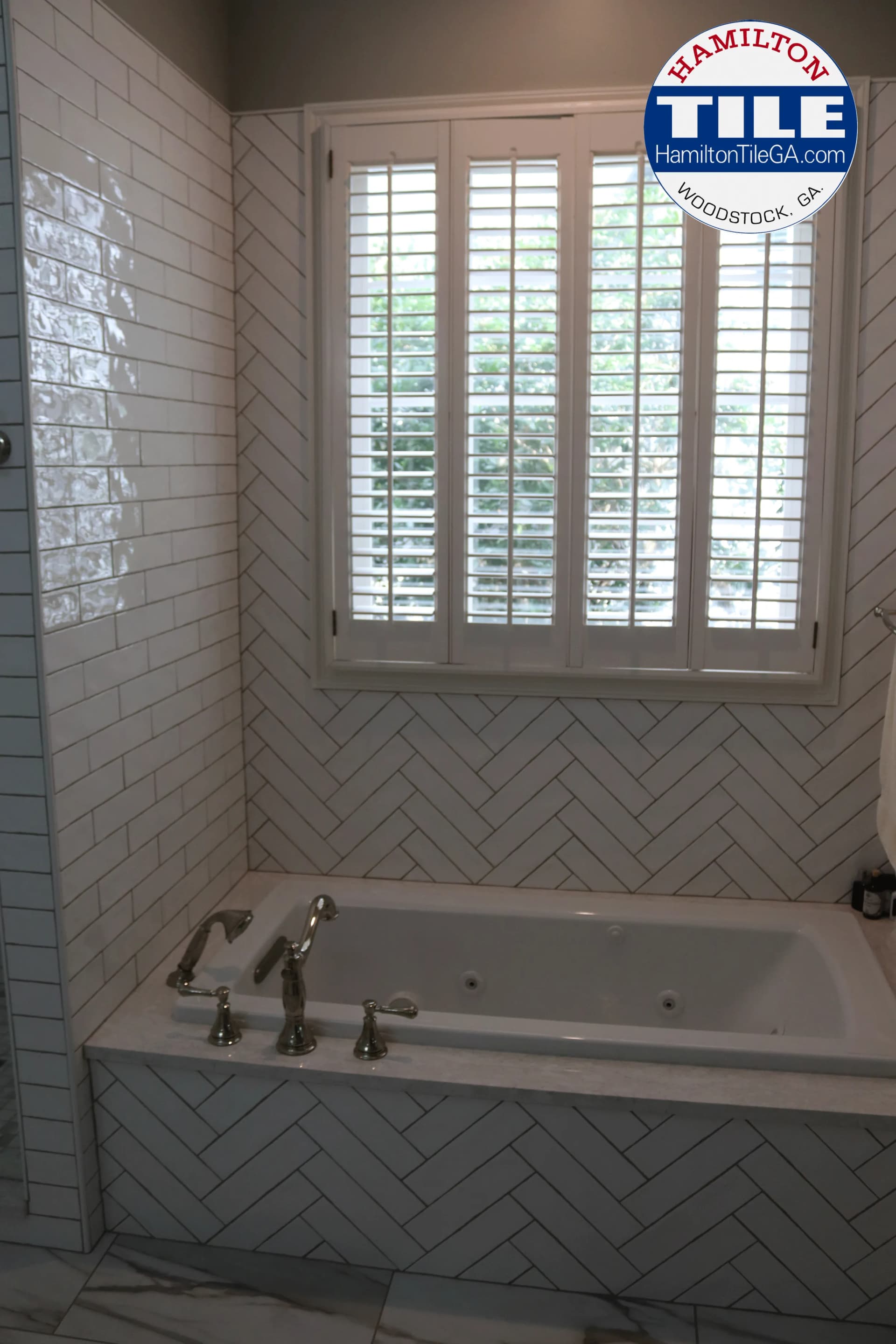 This herringbone accent adds spice to this bathroom without exploding the cost of the install. Watch the video to learn how this herringbone pattern can really add to the bottom line of your bathroom install.