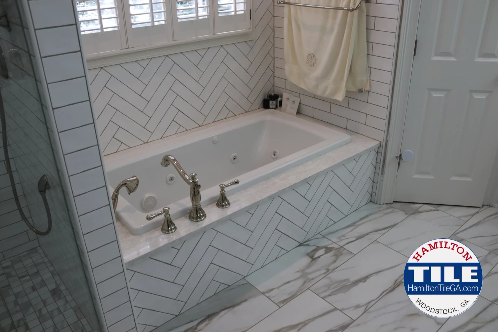 As always, we made the panel in front of the tub removable so the client can always have access to the plumbing under the tub, if, God forbid, something needs to be fixed. Watch the video above to find out how we do it.