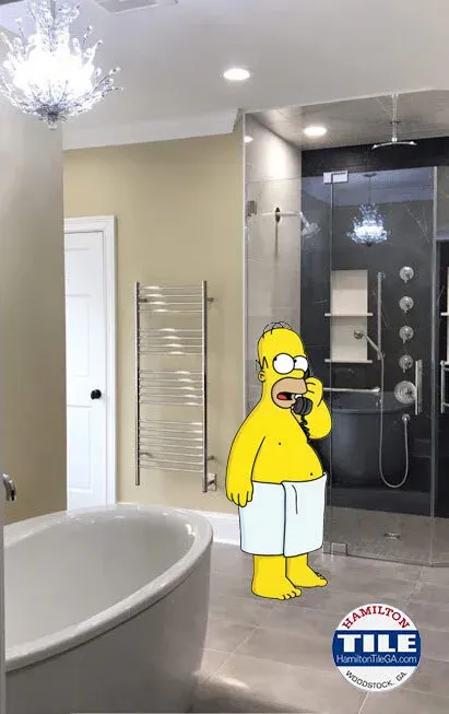 If you decide you’re in the market for a curb-less shower, give us call like Homer here, we’ll get you something that will truly do your home JUSTICE!